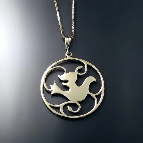 Yellow Gold Dove Pendant. This graceful medallion pendant is sure to become a family heirloom. Featuring a lovely Dove design surrounded by vines.