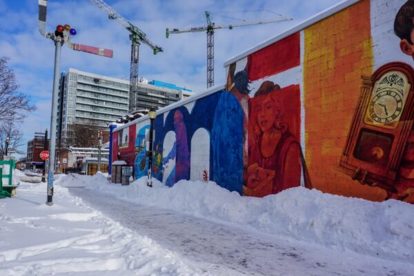 Image of mural beside Ferguson Station with snow on the ground